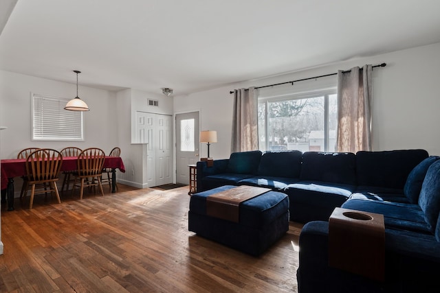 living room with dark hardwood / wood-style floors