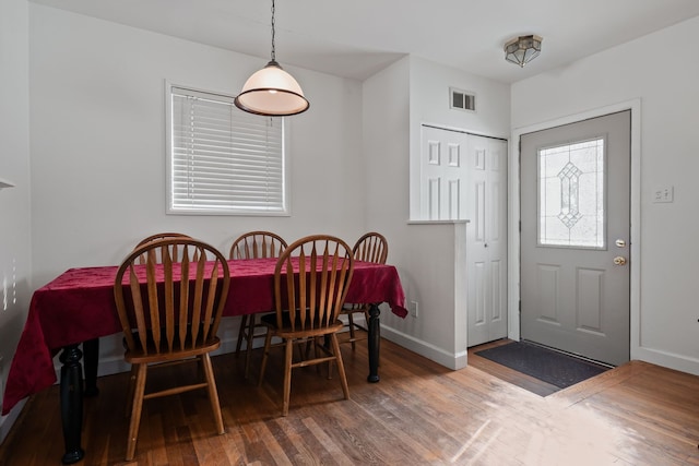 dining area with hardwood / wood-style flooring