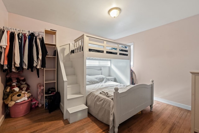 bedroom featuring hardwood / wood-style floors