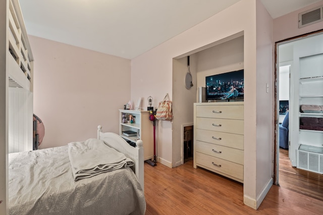 bedroom featuring hardwood / wood-style flooring