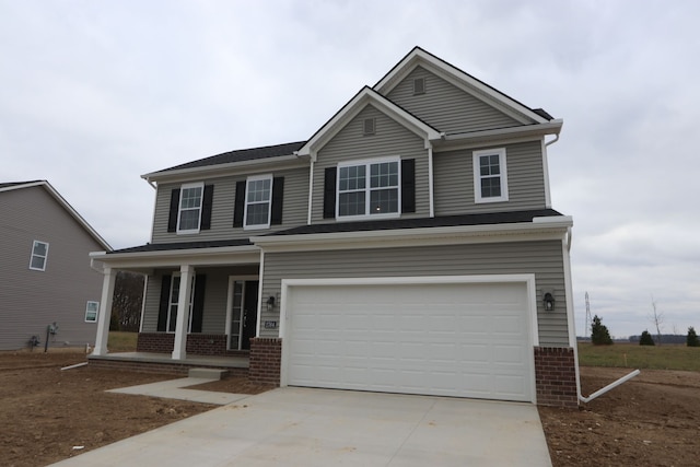 view of front of house with a garage and a porch