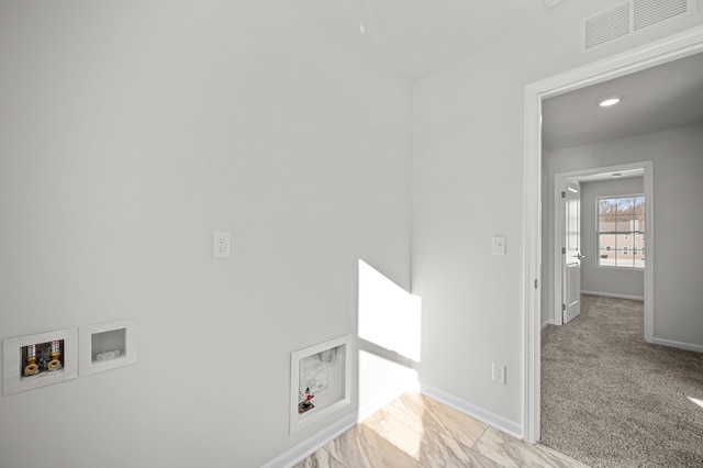 clothes washing area with washer hookup, visible vents, carpet flooring, laundry area, and baseboards