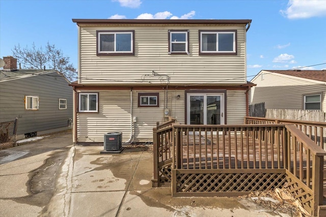 rear view of house with central AC unit, a patio, and a deck