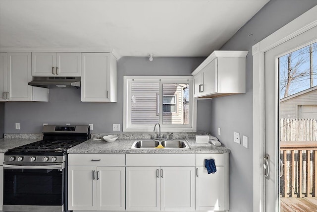 kitchen with white cabinetry, stainless steel range with gas cooktop, sink, and plenty of natural light