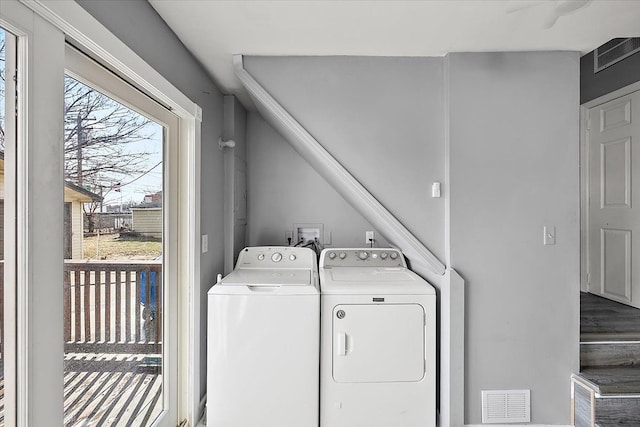 clothes washing area featuring washer and dryer