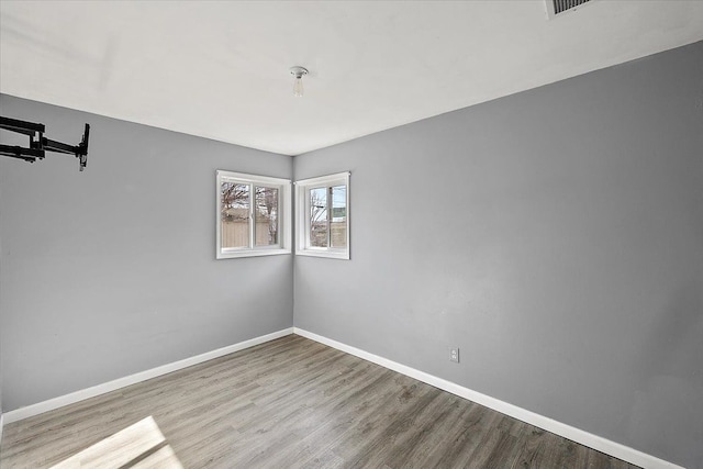 spare room featuring light hardwood / wood-style flooring