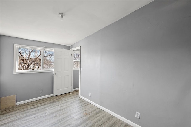 spare room featuring light wood-type flooring