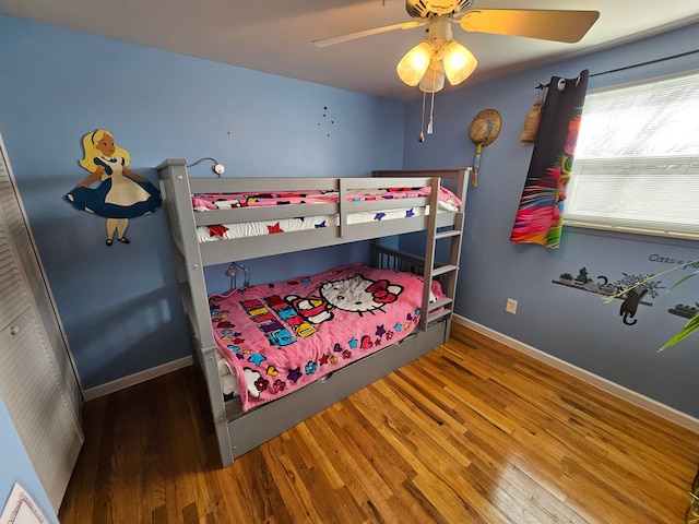 bedroom with hardwood / wood-style flooring and ceiling fan