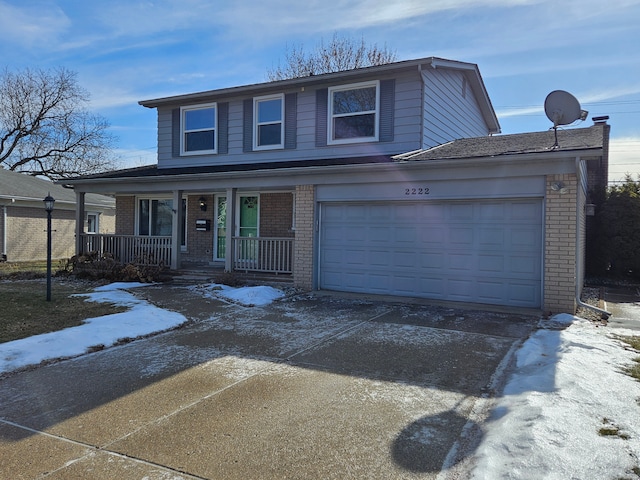 view of front of home featuring a garage and covered porch