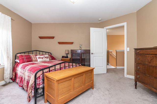 bedroom with light carpet