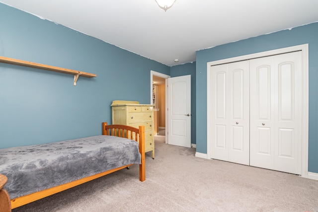 carpeted bedroom featuring a closet