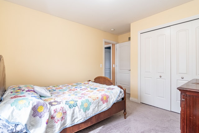 carpeted bedroom featuring a closet