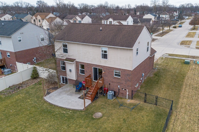 back of house featuring a patio area, cooling unit, and a lawn