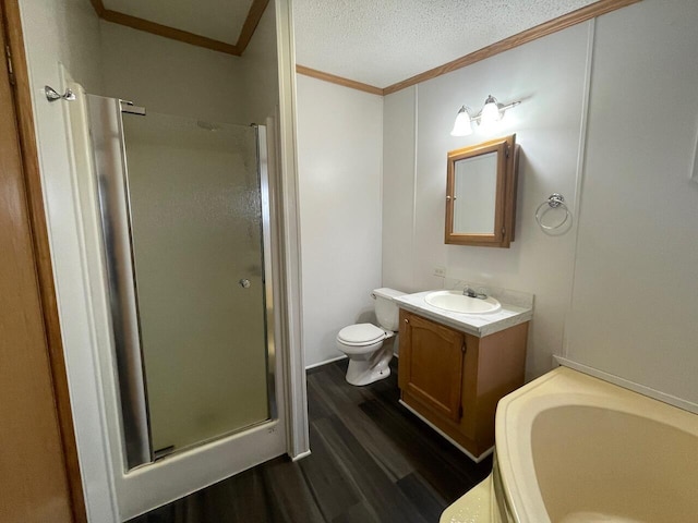 bathroom featuring crown molding, vanity, wood-type flooring, a textured ceiling, and walk in shower