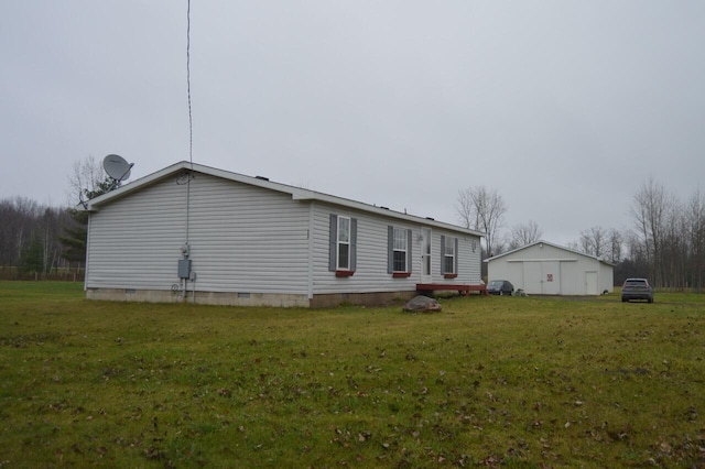 view of side of property with a yard