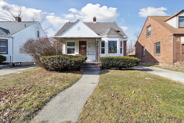 bungalow with a front yard