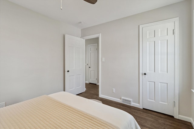 bedroom featuring ceiling fan and dark hardwood / wood-style flooring