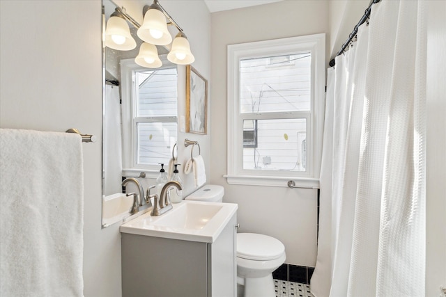 bathroom featuring a shower with curtain, vanity, and toilet