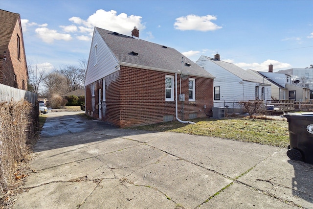 view of home's exterior featuring central AC unit and a patio area