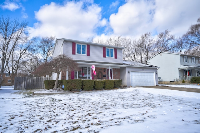 view of front of house with a garage and covered porch