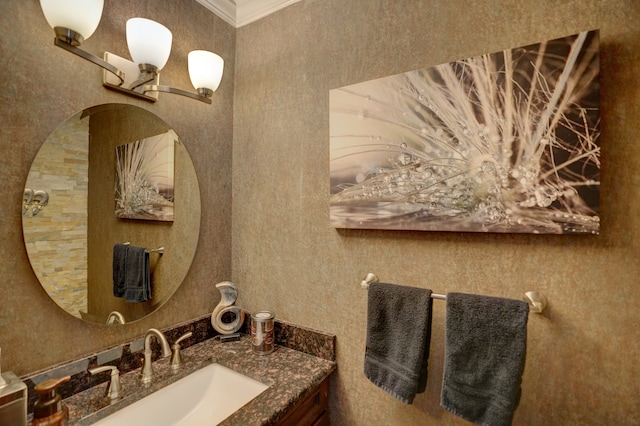 bathroom with vanity and ornamental molding