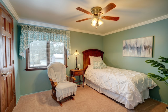 carpeted bedroom featuring ornamental molding and ceiling fan