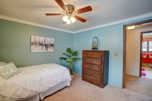 carpeted bedroom with crown molding and ceiling fan