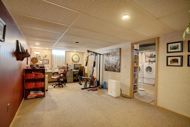 office with washer and dryer, a paneled ceiling, and carpet flooring