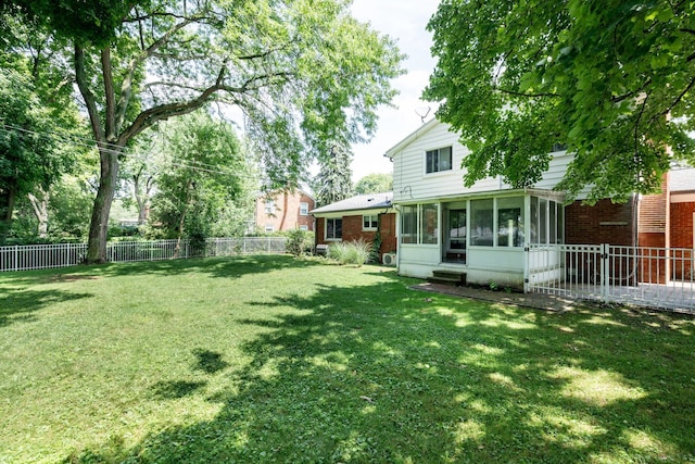 view of yard featuring a sunroom