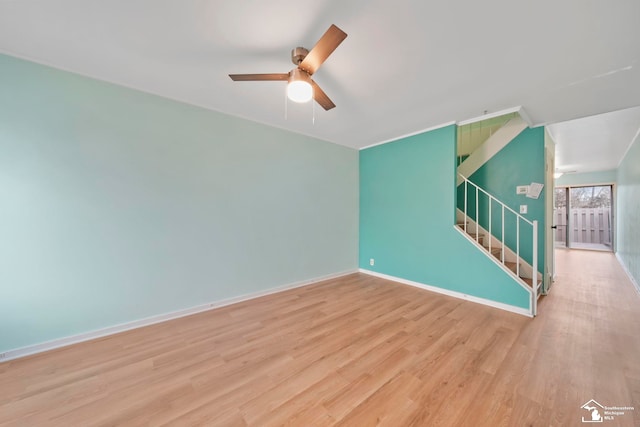 spare room featuring ceiling fan and light wood-type flooring