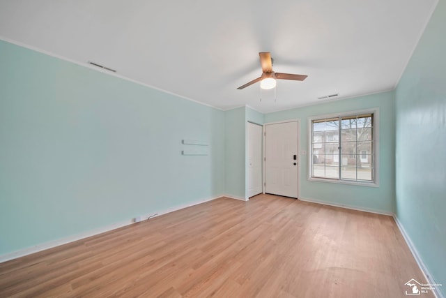 unfurnished room with ceiling fan and light hardwood / wood-style floors