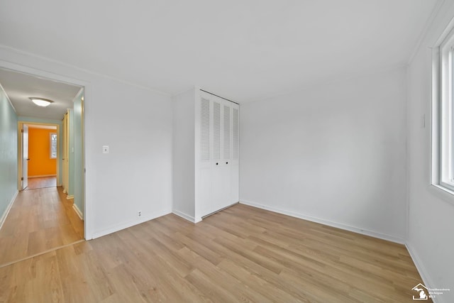 spare room featuring light hardwood / wood-style flooring