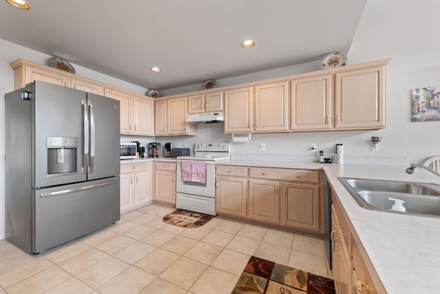 kitchen featuring light brown cabinetry, sink, light tile patterned floors, stainless steel fridge, and white range with electric cooktop