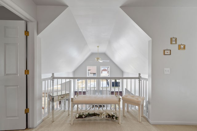 interior space with lofted ceiling and light colored carpet