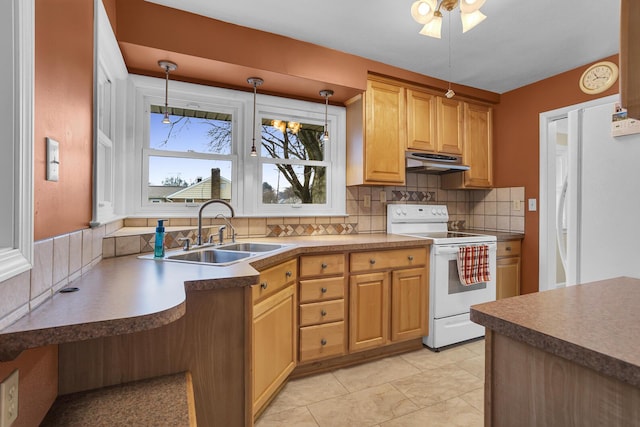 kitchen with pendant lighting, sink, decorative backsplash, light tile patterned floors, and white appliances