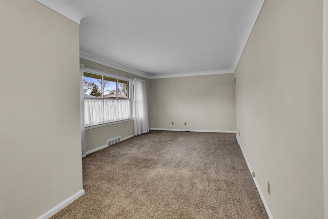 carpeted empty room with crown molding