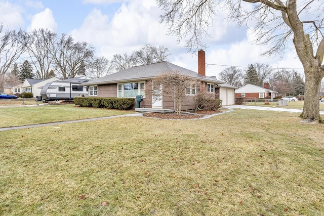 ranch-style home with a garage and a front yard