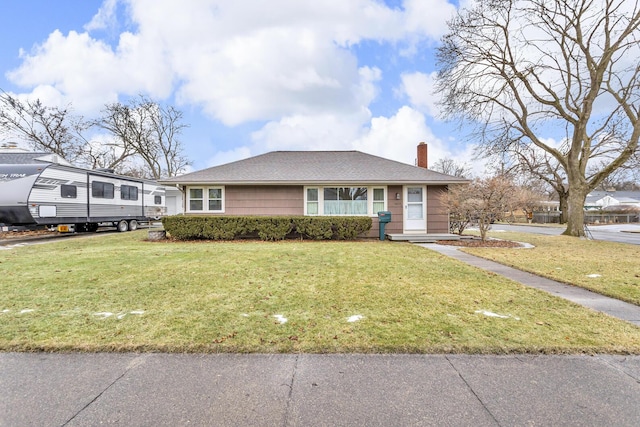 view of front of home featuring a front lawn