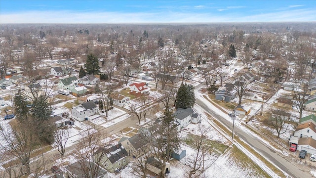 snowy aerial view with a residential view