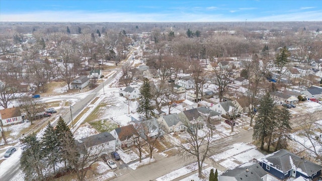 snowy aerial view with a residential view