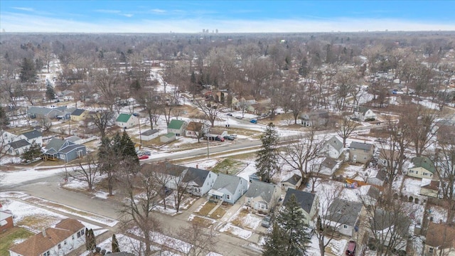 snowy aerial view with a residential view