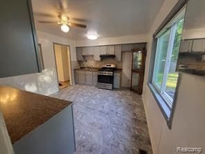 kitchen with gray cabinets, extractor fan, stainless steel range with electric cooktop, and ceiling fan