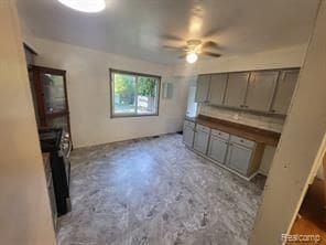 interior space featuring ceiling fan