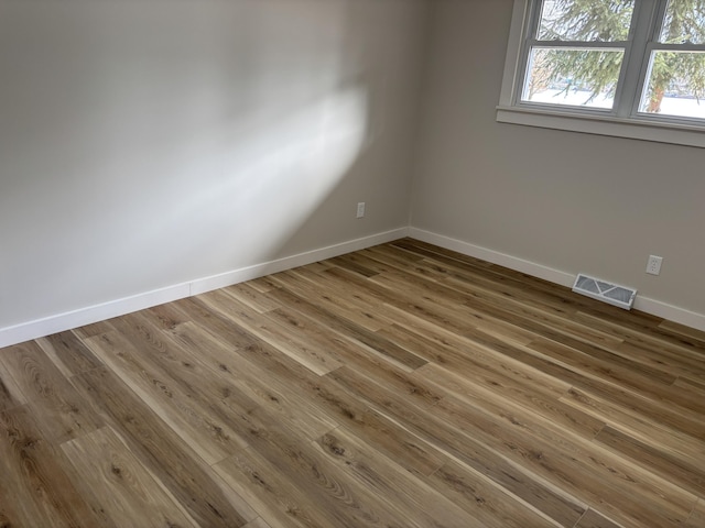 empty room featuring wood-type flooring