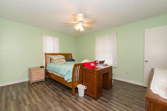 bedroom with dark hardwood / wood-style floors and ceiling fan