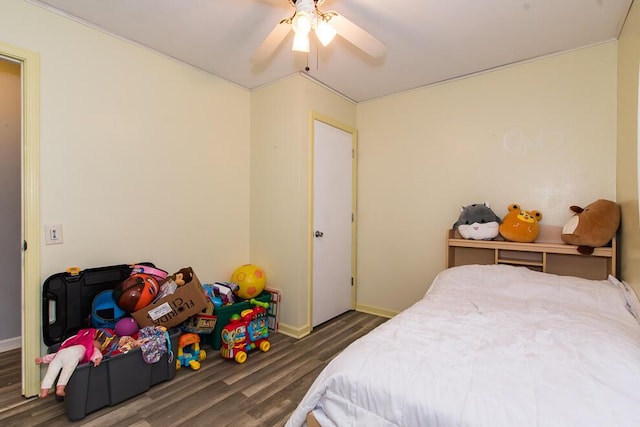 bedroom featuring ceiling fan and dark hardwood / wood-style flooring