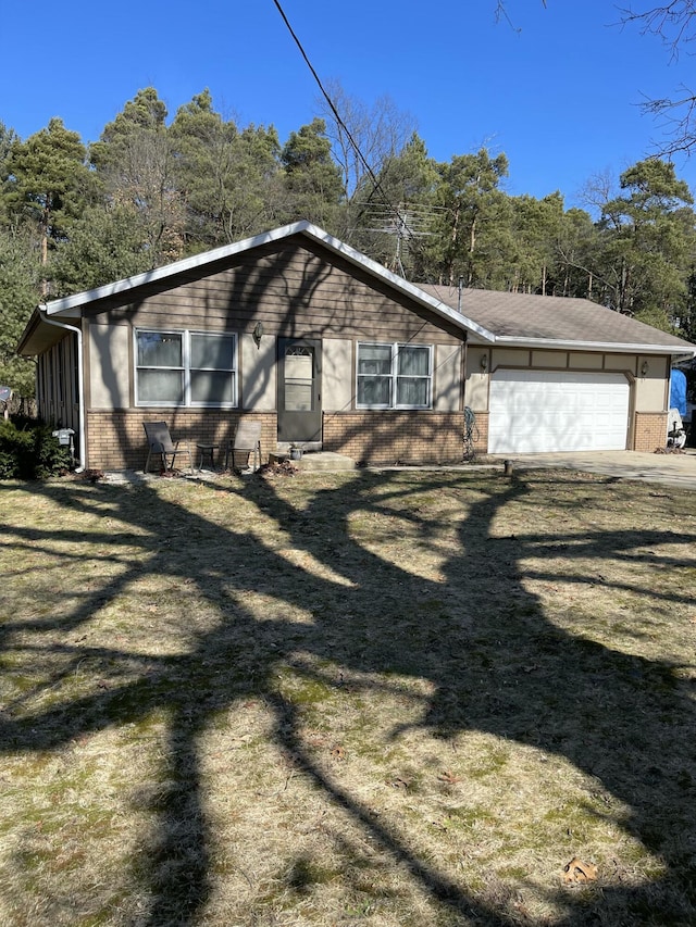 view of side of home featuring a garage and brick siding