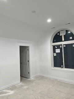 unfurnished room with baseboards and recessed lighting