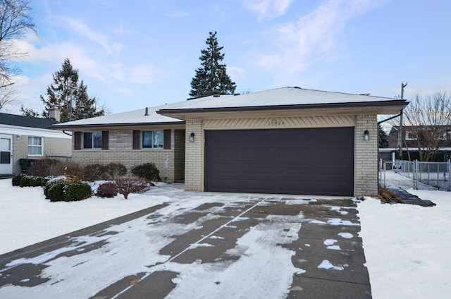 ranch-style house featuring a garage