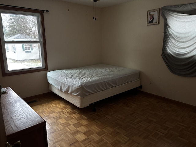 bedroom with parquet flooring